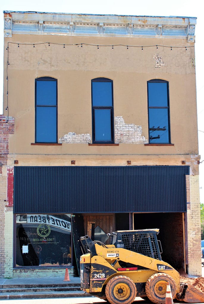 picture of historic building with construction equipment
