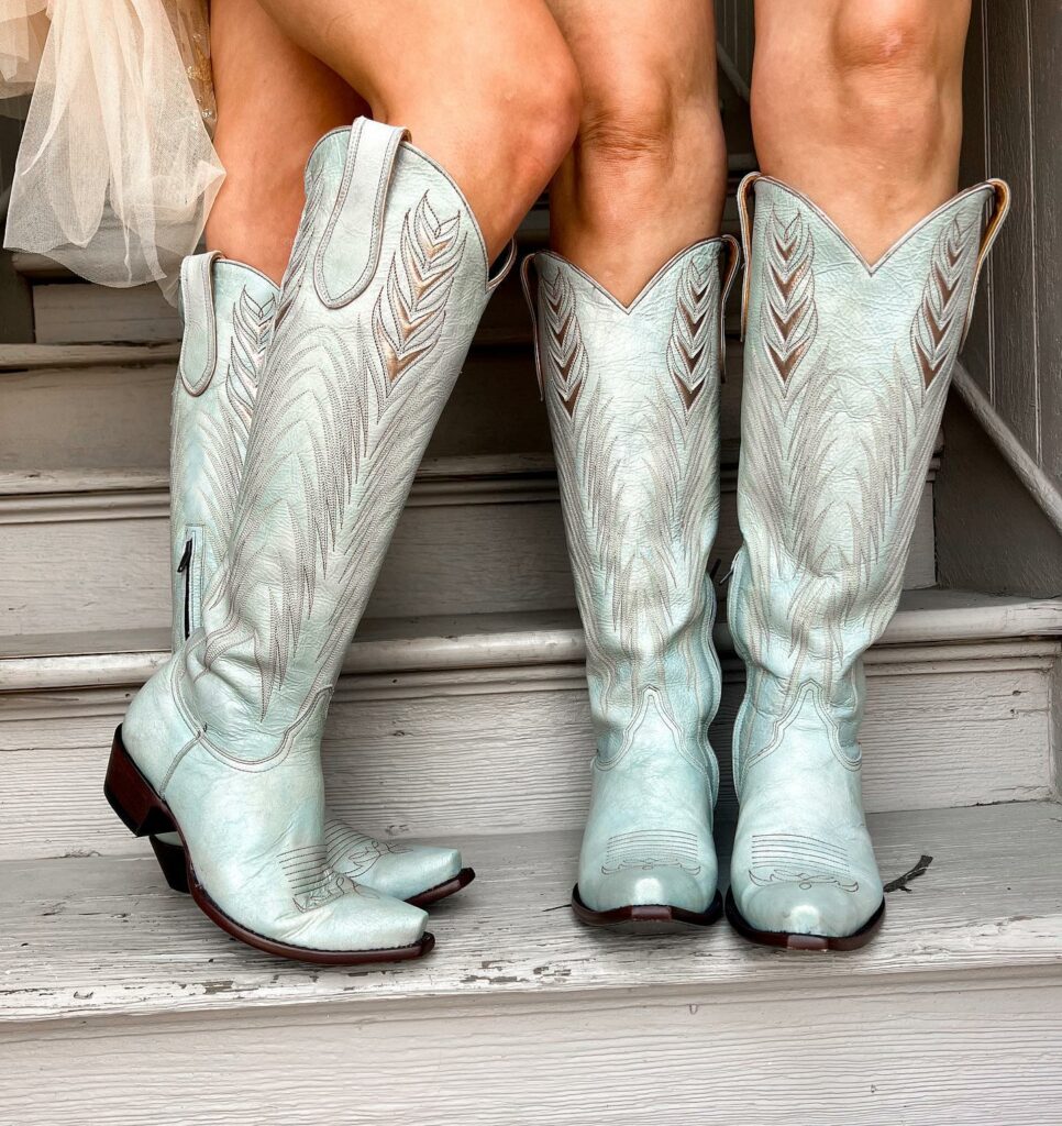 Two pairs of silver cowboy boots